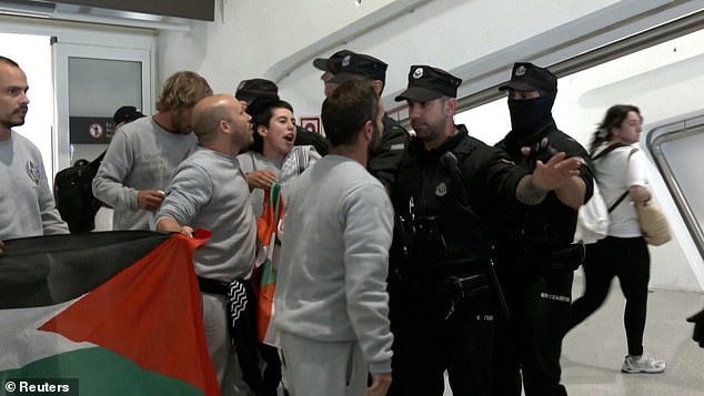 Basque police beat activists returning from Israel in chaotic Bilbao airport clash