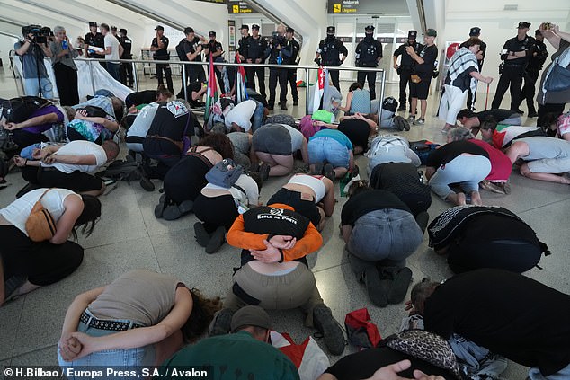 Basque police beat activists returning from Israel in chaotic Bilbao airport clash