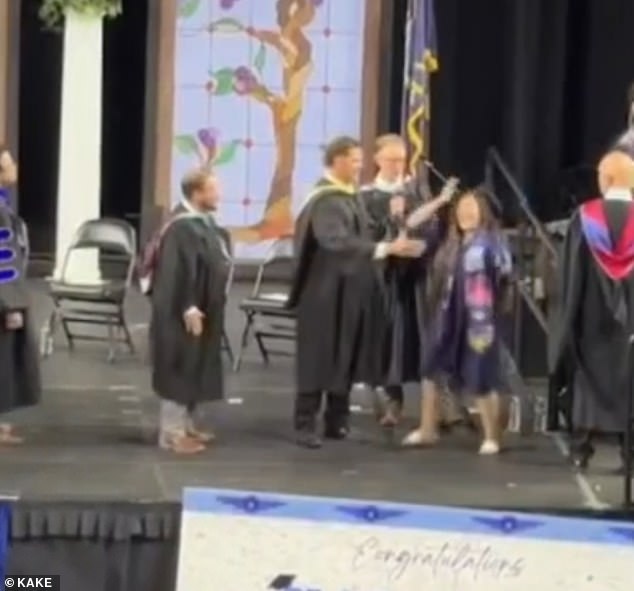 Kansas graduates forced to shake administrator's hand during chaotic ceremony