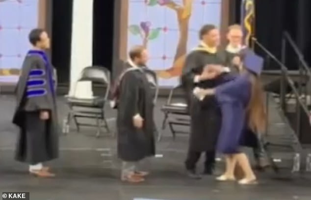 Kansas graduates forced to shake administrator's hand during chaotic ceremony